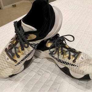 Nike Giannis Immortality athletic shoes. Definitely worn, but in good shape.